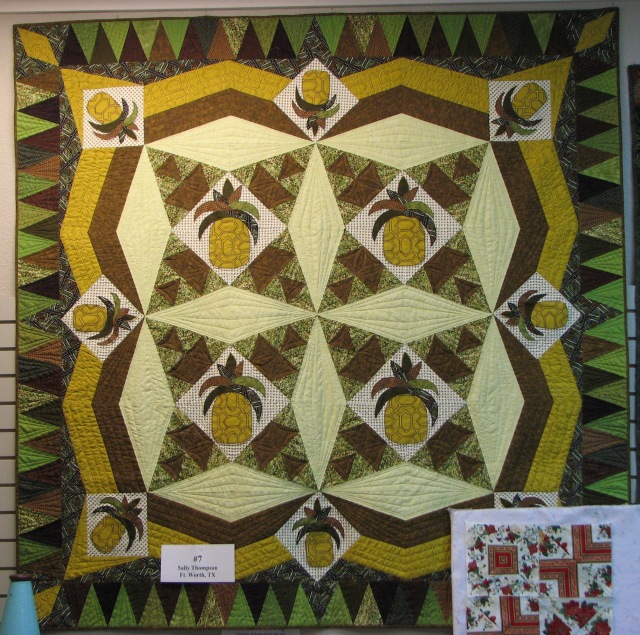 The pineapples carry this ugly fabric very well. The quilter said the fabric 